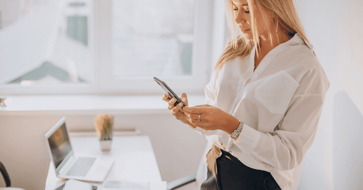 Woman on her phone at work
