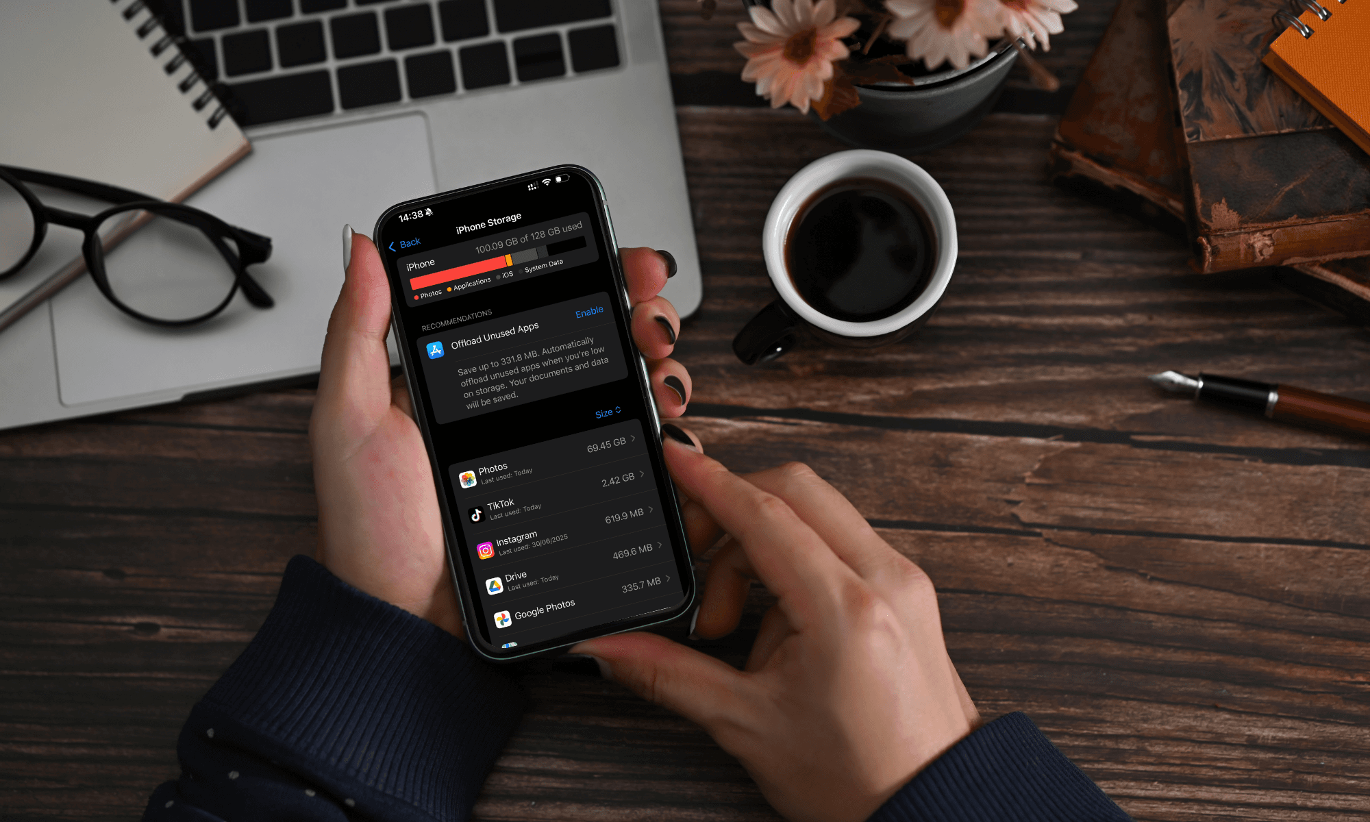 Close-up shot of a person holding their phone and checking its storage capacity.